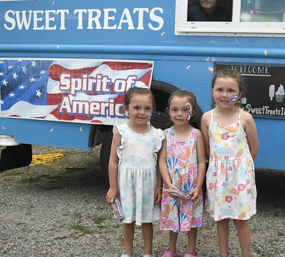 CCM/Carol McIntireThe Leslie sisters (from left) twins Eliza, Elianna, and Rylee stayed cool with a popsicle from Sweet Treats.