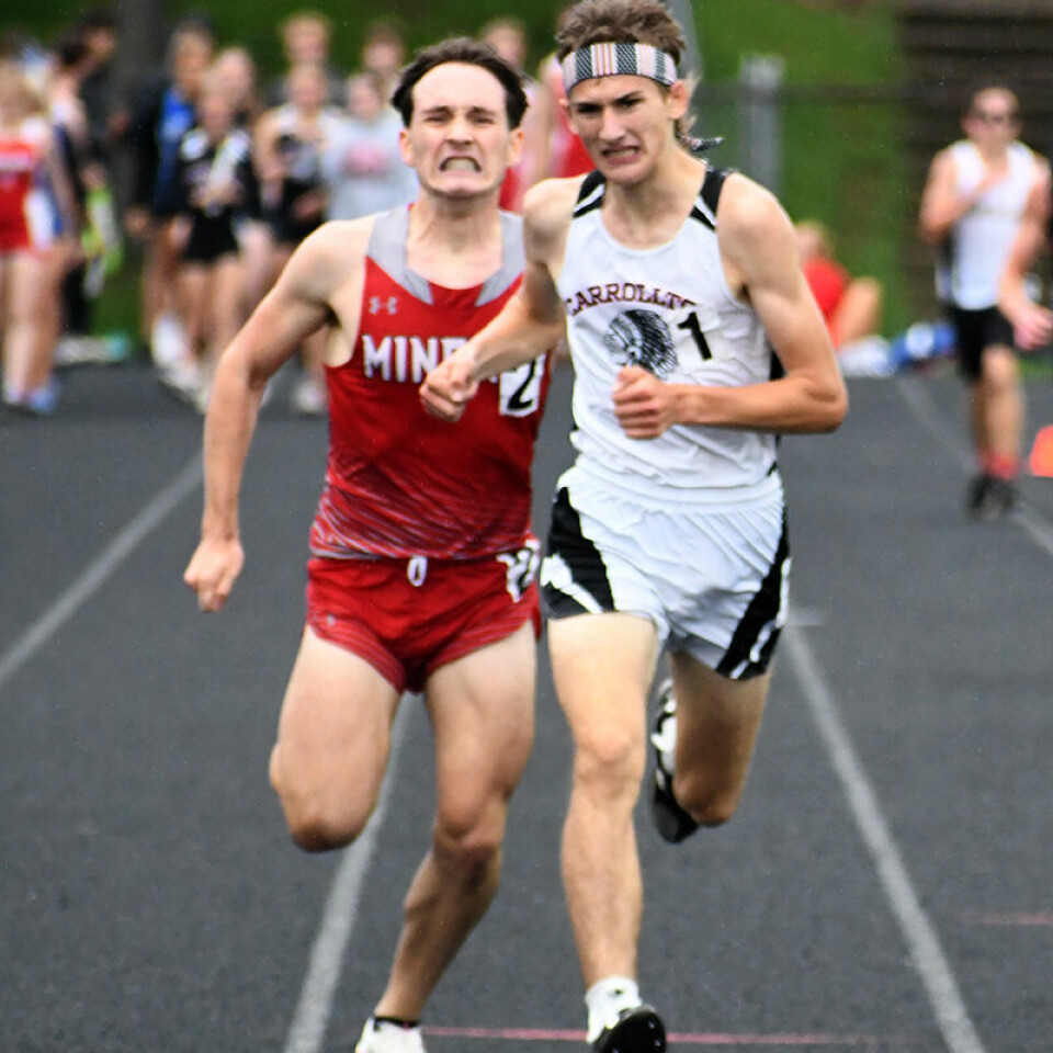 CCM/Carol McIntireCarrollton junior Ricky Sibila (white jersey) edged out Minerva junior Grayson Rettig to win the 3200M and set a new district record Friday at West Holmes.
