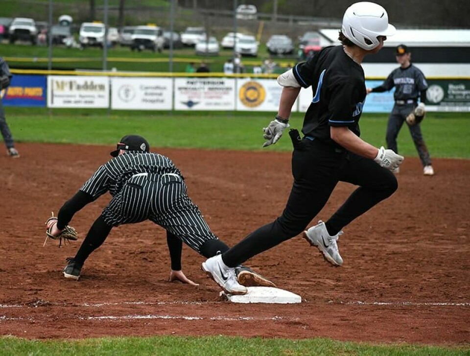 CCM/Dan RiesCarrollton Sophomore Hunter Allison reaches to complete a 4-6-3 double play to end an Aviator rally.