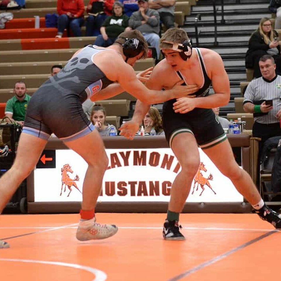 CCM Carol McIntire/ Zach Babiczuk earns an escape from Clayton Downs and won the215-pound title.