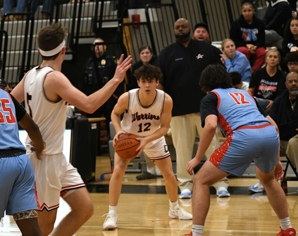 CCM/Dan RiesKeegan Barkan (12) readies to fire a pass to Lincoln Mallarnee (5) in the contest with Alliance last week. Mallarnee moved into the list of top 10 all-time scorers at CHS during the game.