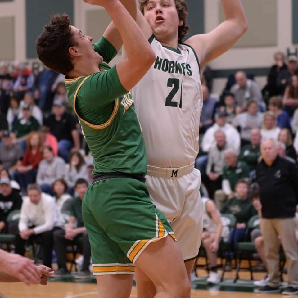 CCM/Carol McIntireMalvern senior Mitch Minor (21) denies a shot off the hands of Rocket Brooks Bower.