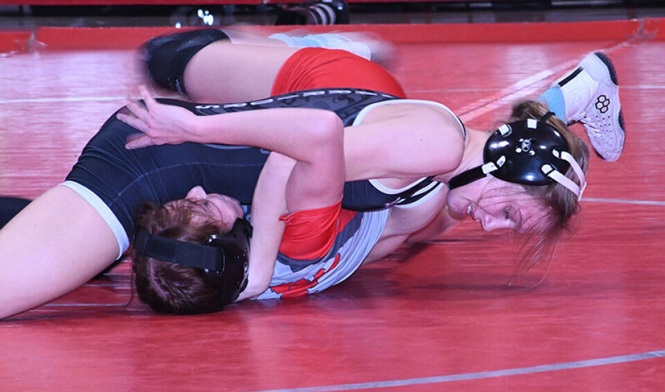 CCM/Carol McIntireCarrollton’s Izzy Nuzzolillo (top position) pinned Ella French (1:13) in the 100-pound match to kick off the girls competition.
