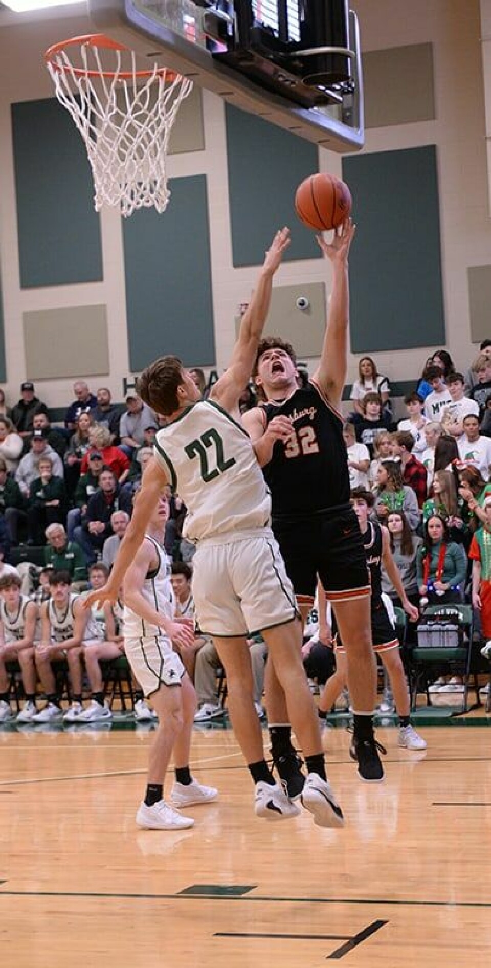 CCM/Carol McIntire Hornet Jared Witherow (22) looks to deny the shot of Gage Moore during a Dec. 22 contest at Malvern.