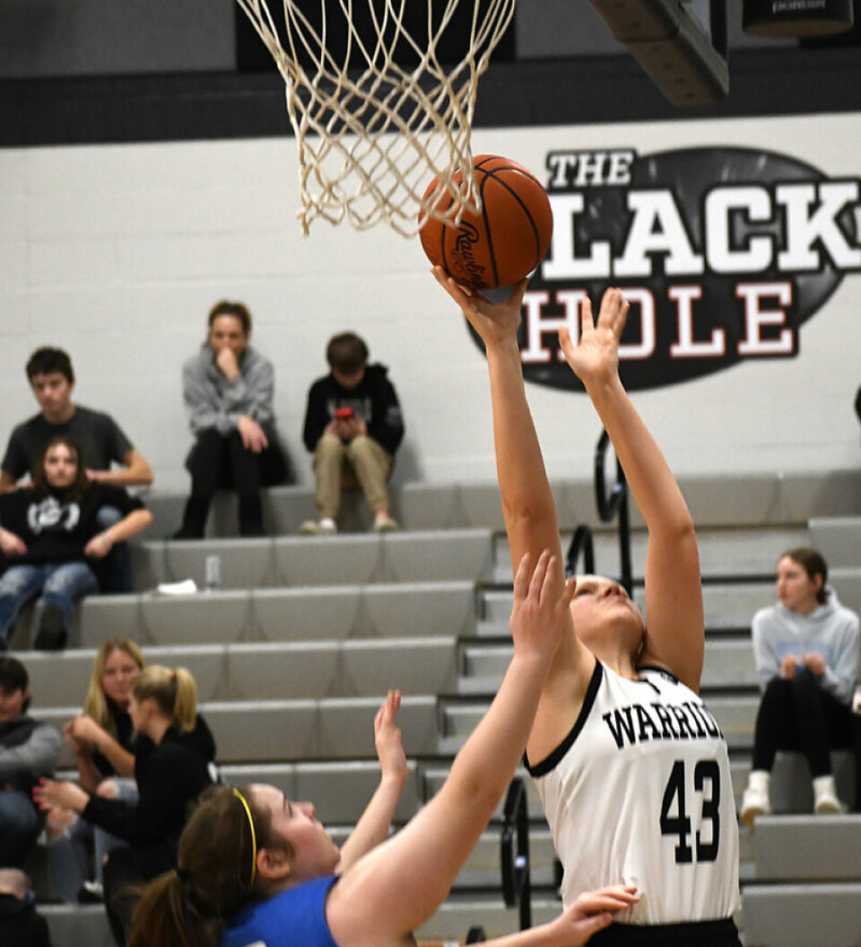 CCM/Dan RiesCarrollton Warrior Maleyna Havens (43) stretches for an inside shot during the sectional game with Maysville. Havens scored her first 3-point shot of the season during the contest.