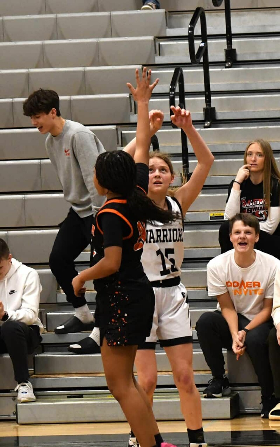 CCM/Dan RiesCarrollton sophomore Kylie Ujcich (15) releases a shot to score three of her career-high 23 points against North Canton Hoover.