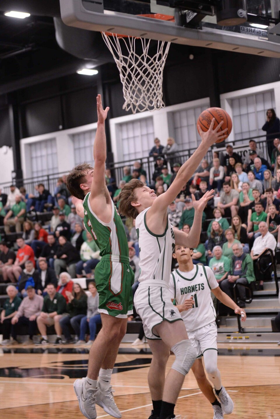 Drake Hutchison scores a layup during the district semifinal against Barnesville.