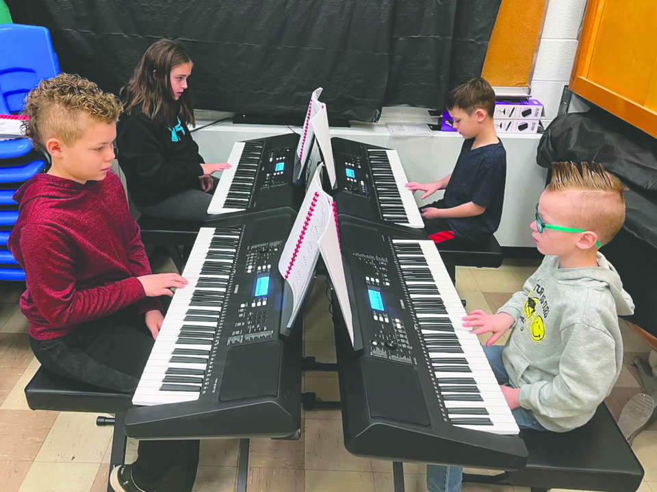 Submitted PhotoJohn Gregg Elementary third-graders (clockwise from left) Talon Glover, Gemma Fuller, Kyler Blancato and Brantley Miller practice on new keyboard kits purchased with a grant from the Bergholz Community Foundation.