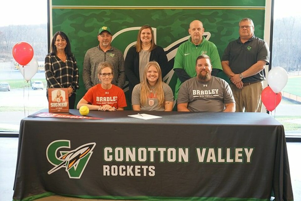 Submitted PhotoThose joining Conotton Valley softball player Masy Baker for a ceremonial college signing are shown above. Seated from left are Heather, Masy and Jason Baker. Standing behind are High School Principal Danielle Caldwell, Rocket Head Softball Coach Jeremy Bleininger, Coach Karlee Dawson, Athletic Director Ed Marsh and Superintendent John Zucal.