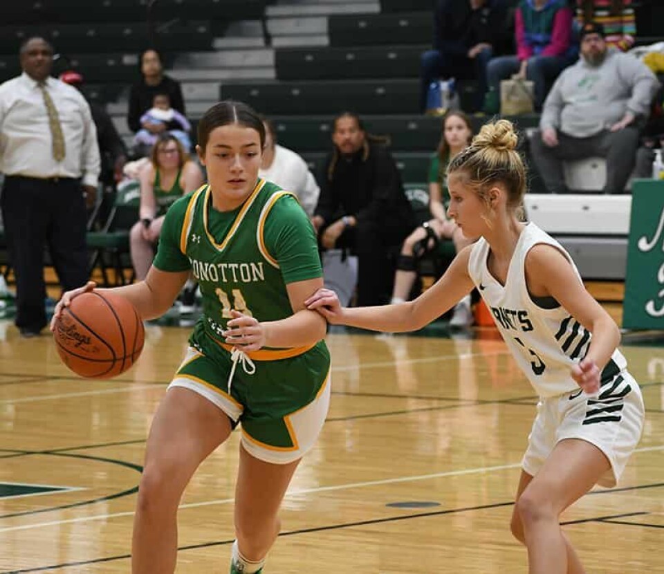 CCM/ Dan RiesConotton Valley sophomore Delilah Williams (14) dribbles around Malvern guard Addison Mitchell during an Inter Vallåey Conference contest Dec. 20 at Malvern.