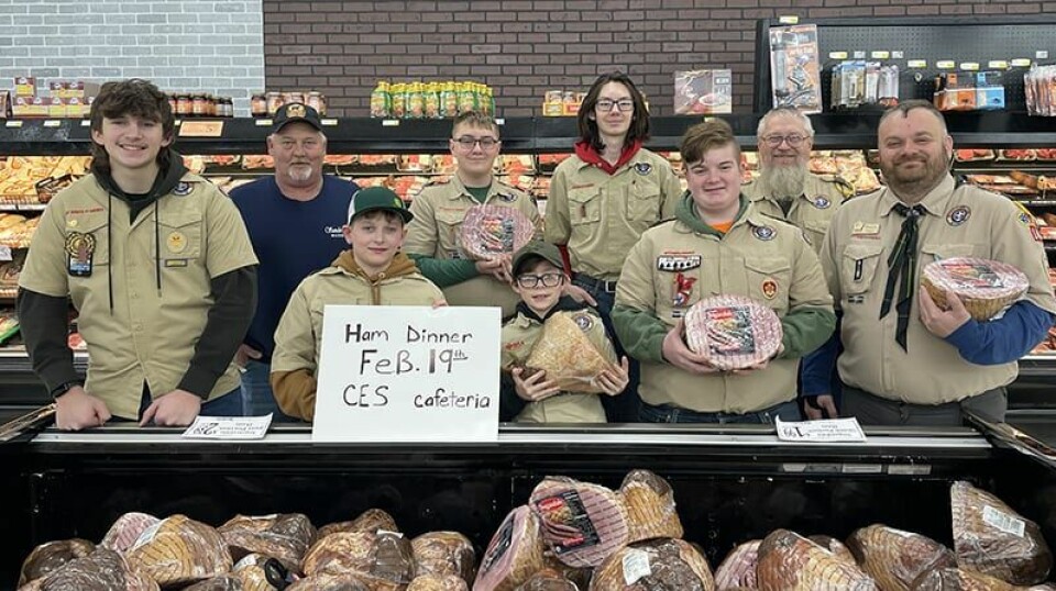CCM/Carol McIntire Members of Carrollton Boy Scout Troop 141 stopped by Sanders Market Jan. 14 to promote the return of the popular ham dinner. Scouts shown above with leaders and a Sanders official. Front row from left: Graden Cook, Parker McIntire, Kyle Burkhart, Hayden Paul and Scout Master Shaun Paul. Second row: Jim Shaw, meat department manager at Sanders, Cooper Becknell, Koda Hoobler and Bryan Becknell, assistant scout master.