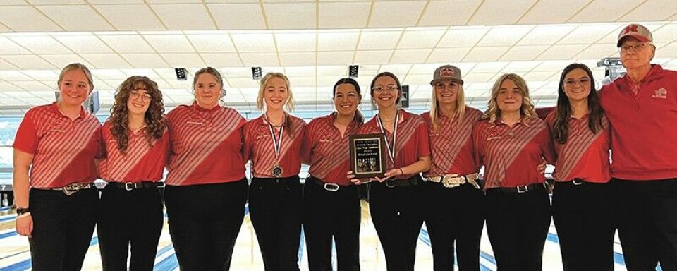 Submitted PhotoThe Minerva Lady Lions captured the champonship title at the Quaker Challenge Dec. 16 at Boulevard Lanes. From left are Coach Megan Keister, Bailey Wood, Lillian Kugler, Jadynn Thompson, Rylan Klitz, Shelby Worrell, Anna Leach, Kayla Henderhan, Izabelle Genet and Coach Dana Keister.