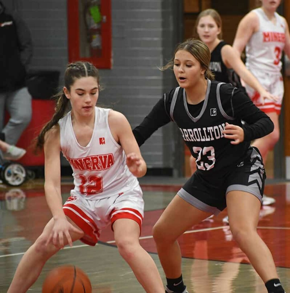 CCM/Dan RiesWarrior Jordan Pittman (23) defends against Lion Delaney Sell in a game last week at Minerva.