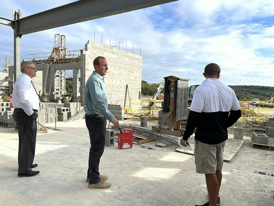 CCM/ Carol McIntireCarrollton Schools Superintendent Dave Davis (left) and Brian Malinsky, project manager, GreenSpace Construction Services, explain the features of the front entrance to Board Member Jonathan Naylor (right).