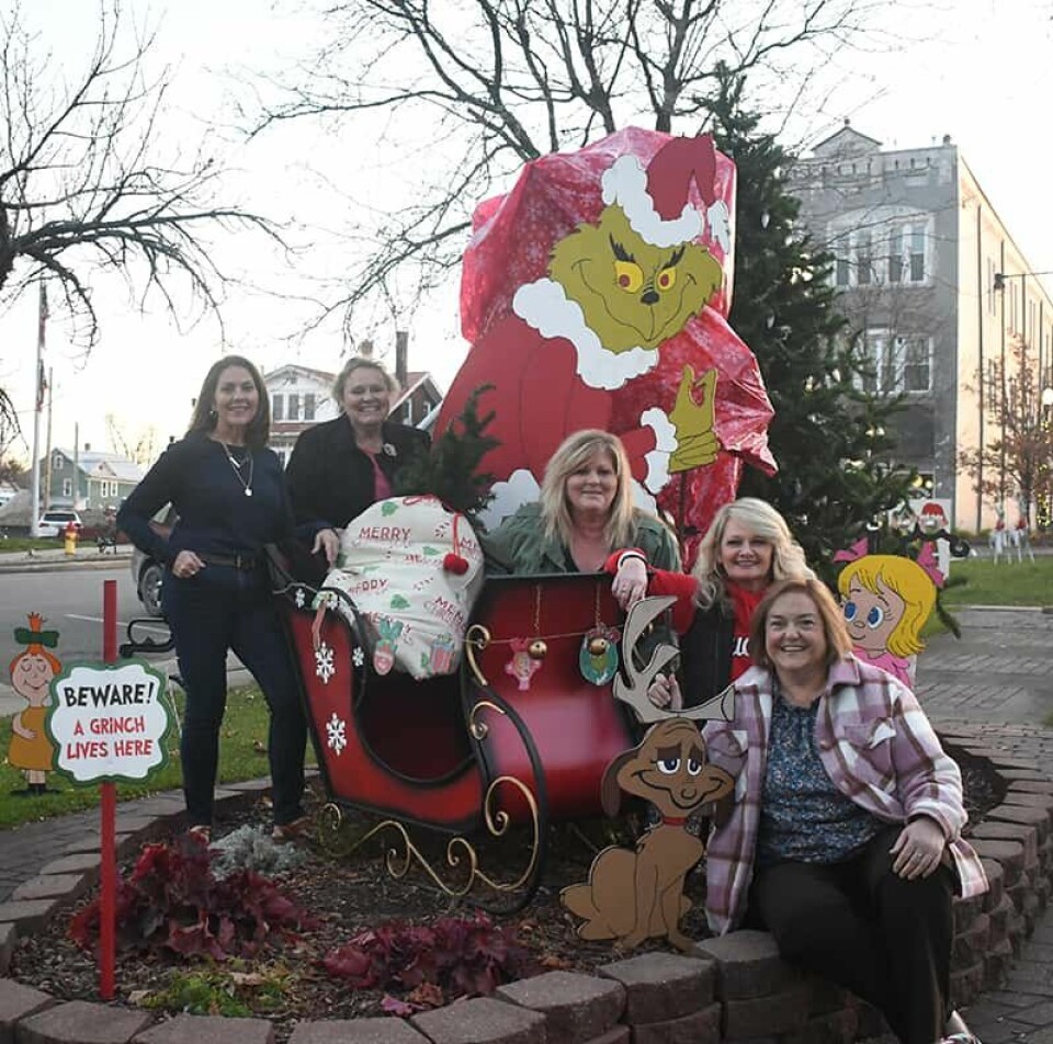 CCM/ Carol McIntireCarrollton Business Women members transformed Carrollton Public Square into Who-ville, complete with a seven-foot Grinch, for the holiday season. The club is sponsoring a Ginch costume contest prior to the Carrollton Christmas parade Nov. 25 to go along with the theme. Five Christmas decorating committee members are shown above with the centerpiece of the decorations. From left are Sharon Bellamy, Deb Senko, Susan Williamson, Bridget Hepner and Ellen Finnicum.