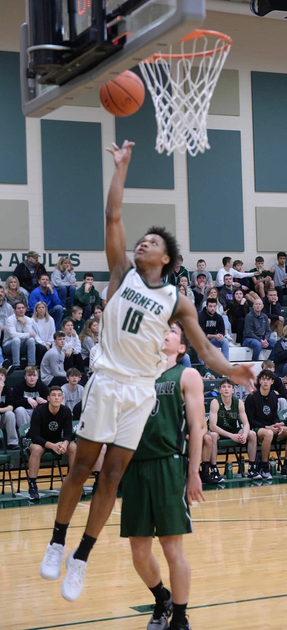 CCM/Carol McIntireMalvern senior J’Allen Barrino (10) lays a shot in over Dawson Young of Smithville in the season opener Friday at Malvern. Barrino scored 27 points.
