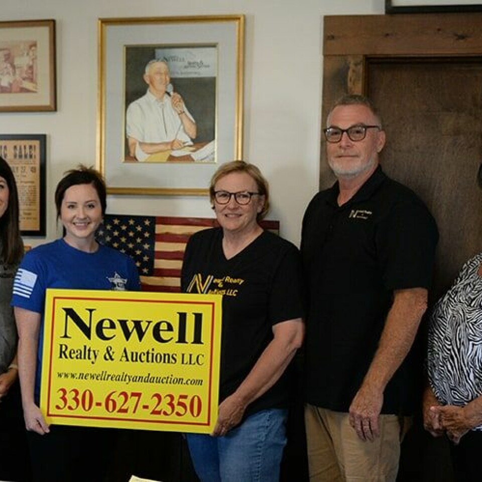 CCM/ Carol McIntireAn open house is planned Sept. 22 at Newell Realty & Auctions to celebrate the 80th anniversary of the buiness started by the late Bob Newell in 1943. In the above photo, a portrait of Newell appears to watch over his family members, who now operate the business. From left are Casey Brunoni, Alyssa Newell, Barb Newell Bill Newell and Bonnie Chiurco.