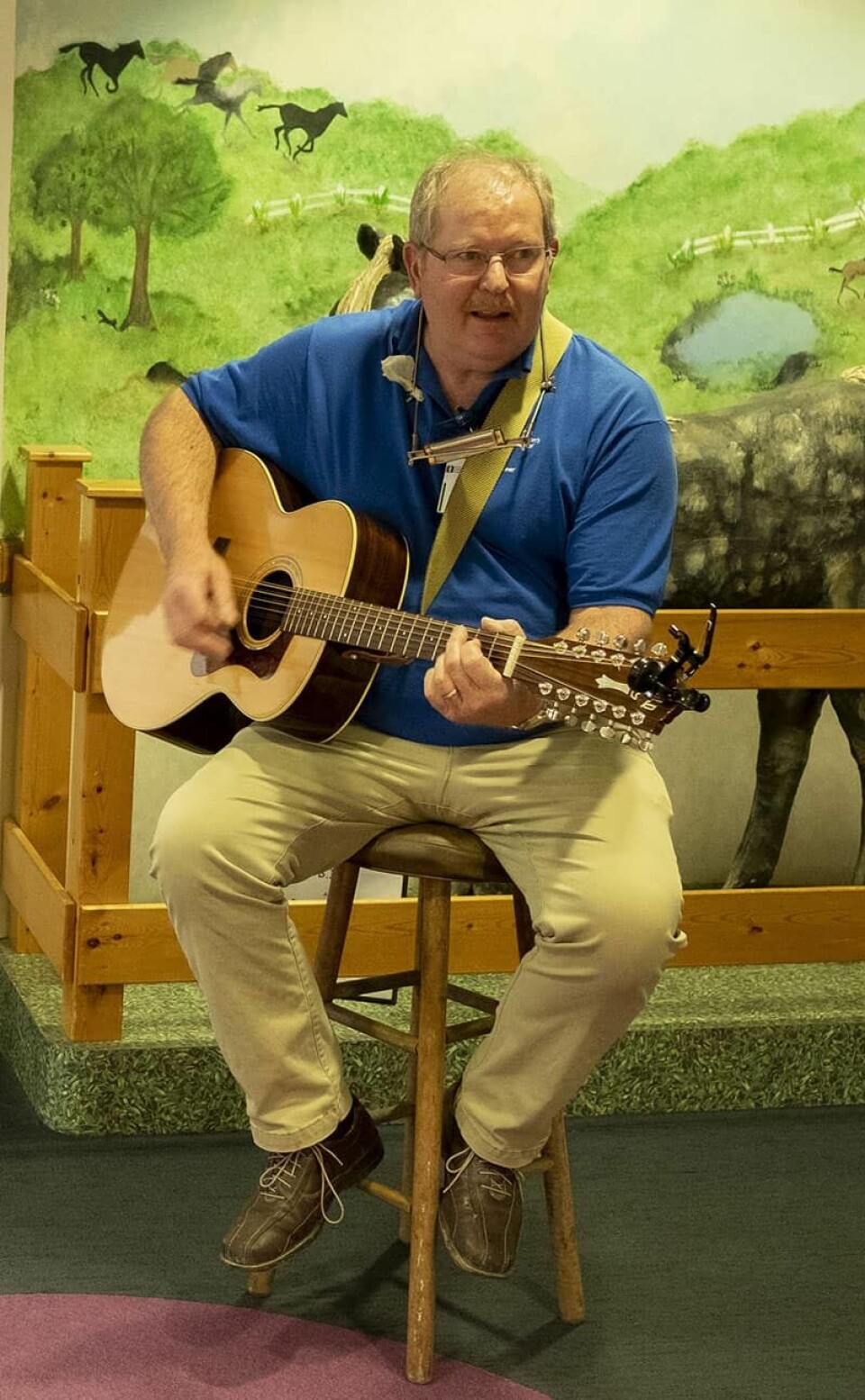 Photo courtesy of Akron Children’s HospitalKeith Barnett uses his voice and guitar to bring smiles and comfort to patients at Akron Children’s Hospital campuses.