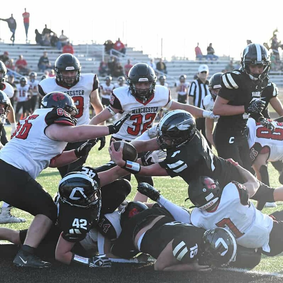 CCM/ Carol McIntireCarrollton quarterback Jacob Whitmore (7) stretches the ball across the goal line for his first touchdown of the game against Manchester. Opening a hole for Whitmore were blockers Owen Spilker (42) and Dillon Naylor (15).