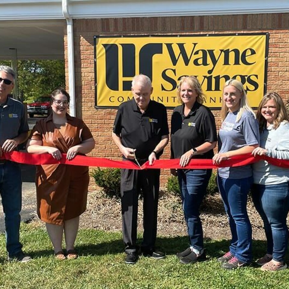 CCM/ Carol McIntireWayne Savings Community Bank officials celebrated the opening of the newest office at 1029 Canton Rd., Carrollton, with a ribbon cutting ceremony Sept. 22.Shown from left are Mark Whitmer, executive chairman, Chelsa Slutz, Carroll County Chamber of Commerce; Tom Courtright, commercial lender (cutting ribbon); Dawn Devine Price, market development manager; Erin Lucas, officer manager; Laura Liber, customer service representative; Shari Druckenmiller, customer service representative; and Jay VanSickle, president and CEO.