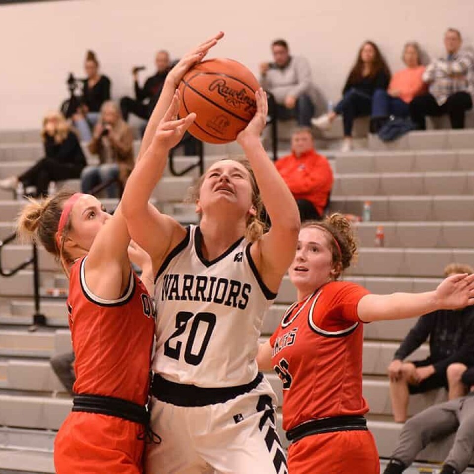 CCM/Carol McIntire Warrior Lauren Marmo (20) splits defenders on her way to the basket against Salem.