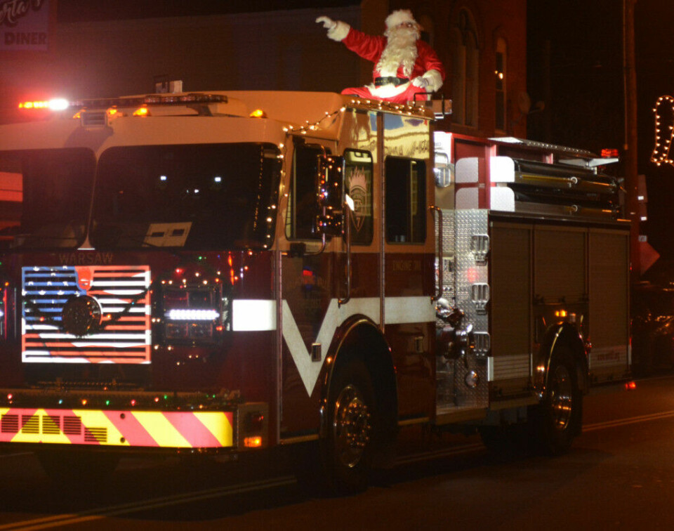Warsaw welcomes holiday season Santa rode into town on top of a Walhonding Valley Fire District truck on Nov. 27 so he could meet with all the girls and boys who had gathered for the Warsaw Candlelighting. Josie Sellers | Beacon