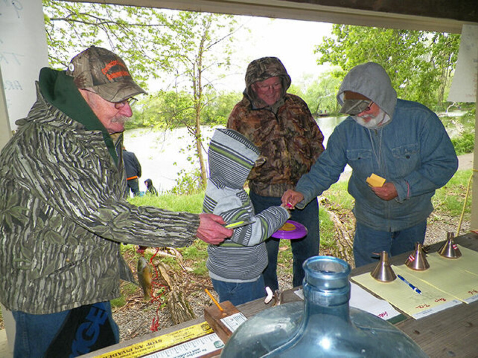25th annual fishing derby held at Lake Park CCSA members Skip Lawrence, Kendall Woods and Ray Rogers offer small prizes to a young fisherman who had just had his catch measured at the CCSA Fishing Derby on May 6 at Lake Park. Jen Jones | Beacon