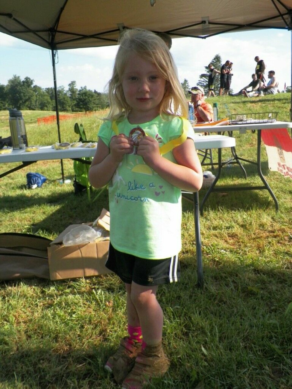 Mud Run brings people from around the country Aspen, 3, was the first child to complete the children’s course and she was excited about her medal – and her muddy shoes. Jen Jones | Beacon