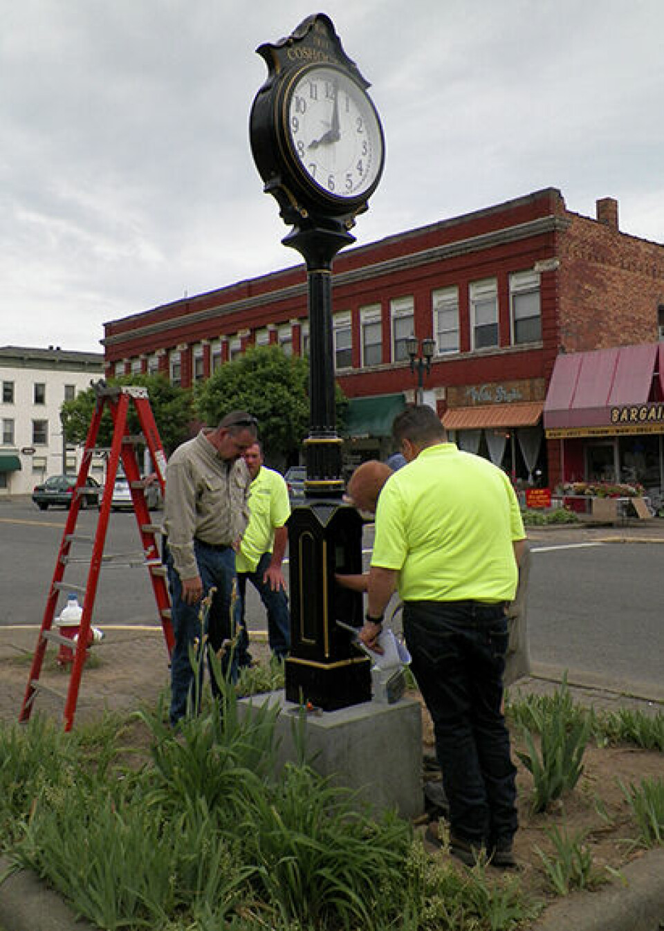 Our Town Coshocton installs clock on Main Street
