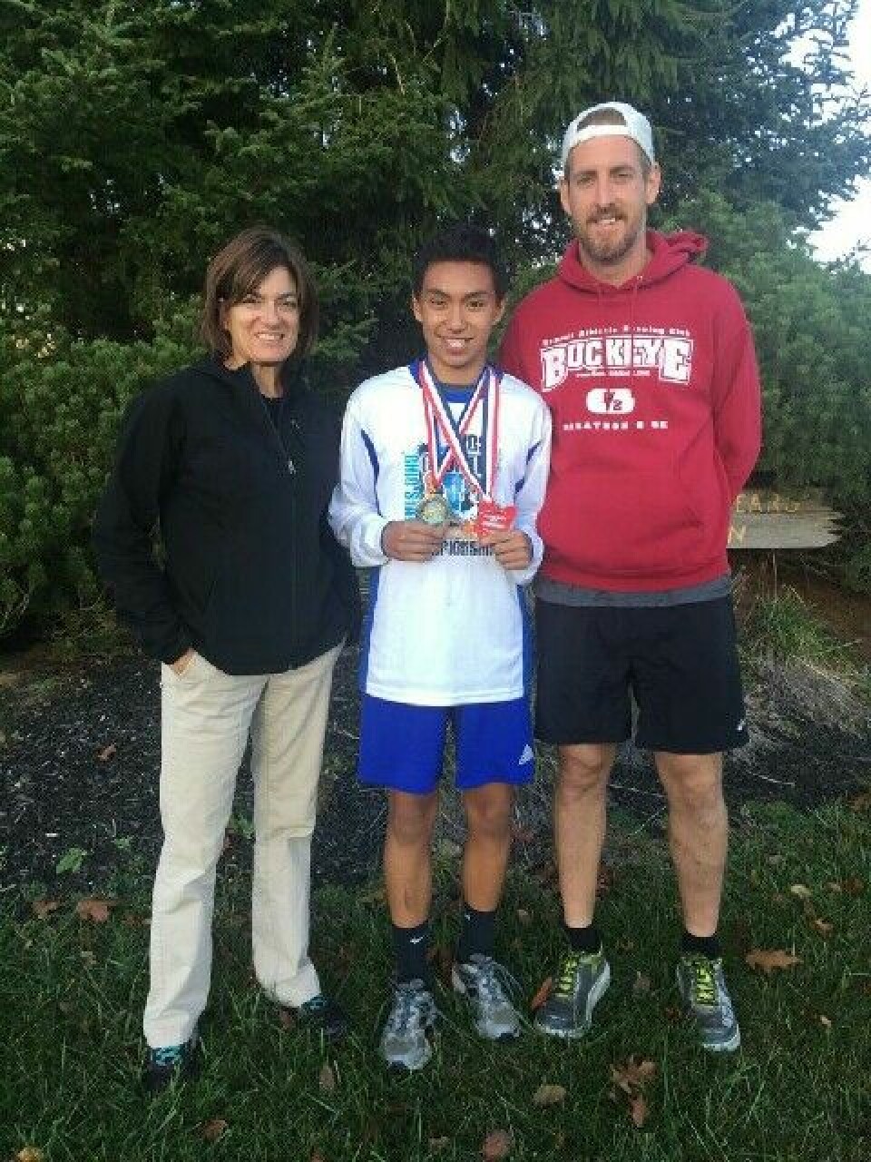 River View captures state title in boys cross county River View’s Javin Robinson (middle) placed first in the junior high boys’ cross country meet Oct. 23 at Hilliard Bradley High School. He is pictured here with River View’s high school cross country coach Gwenna Neal and junior high coach Dennis Wilson. Contributed | Beacon