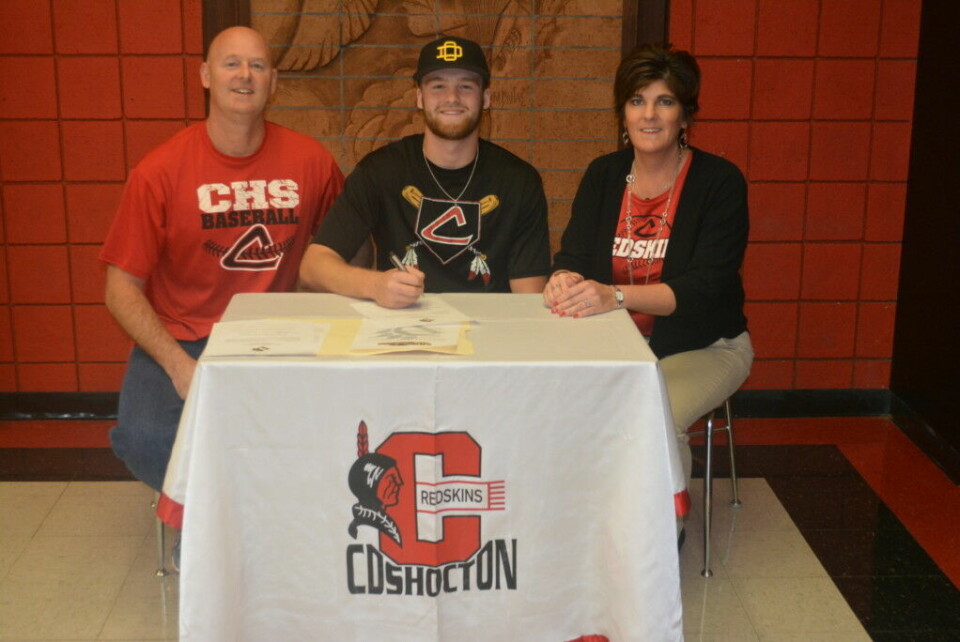 Mason signs with Ohio Dominican Andrew Mason, center, signed to play baseball at Ohio Dominican University. At left is his father Brent Mason and at right is his mother Beth Walsh. Mason is a senior at Coshocton High School and catches for the Redskins. Josie Sellers | Beacon