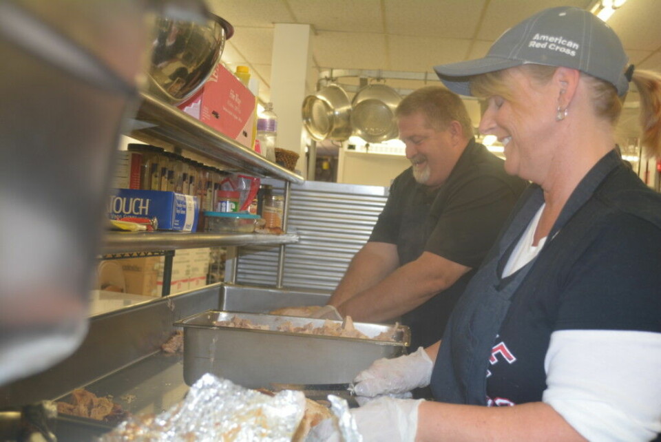 Coshocton High School invites community for Thanksgiving Jackie Mishler and Tim Howell carve turkeys for the 13th annual Coshocton High School Community Thanksgiving Dinner. Beth Scott | Beacon