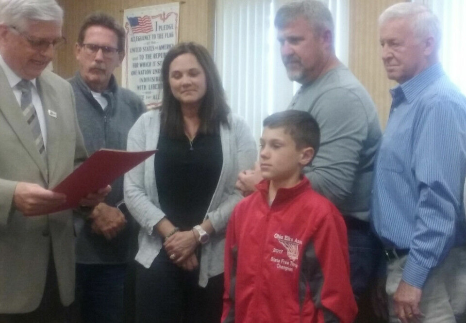 City council honors Colton Conkle Mayor Steve Mercer, pictured at left, presented Colton Conkle (center) with a proclamation celebrating his Elks National Hoop Shoot title during the May 8 Coshocton City Council meeting. Standing behind them are members of city council. Josie Sellers | Beacon