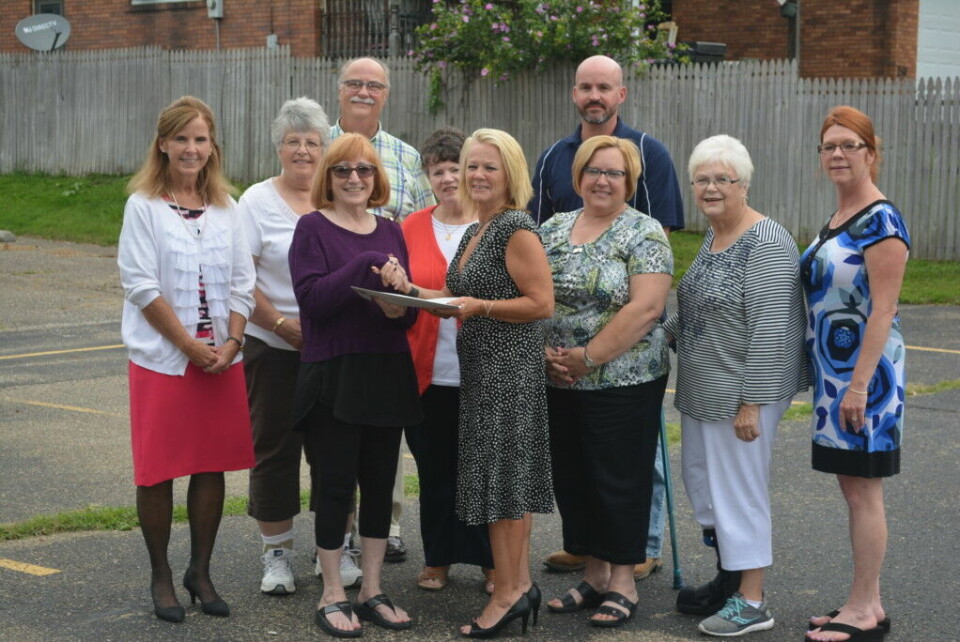 Coshocton Community Housing Inc. donates land to First Step Coshocton Community Housing Inc. recently donated property to First Step Family Violence Intervention Services, Inc. Board members from both organizations gathered together on July 27 to celebrate the occasion. Pictured from left in row one are – Laura Miller, vice president for community housing; Mary Mason, president for community housing; Vicki Laudick Casey, executive director of First Step; Jill Lahna, vice president of First Step’s board; Tomma Bordenkircher, First Step board member; Carey McMasters, First Step board member; and in back are – Carolyn Karr, secretary/treasurer for community housing; Steve Champagne, from community housing; Mary Tracy, First Step board treasurer; and Rob McMasters, First Step board member. Josie Sellers | Beacon