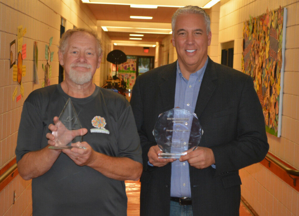 Oster, McCarty presented with awards
