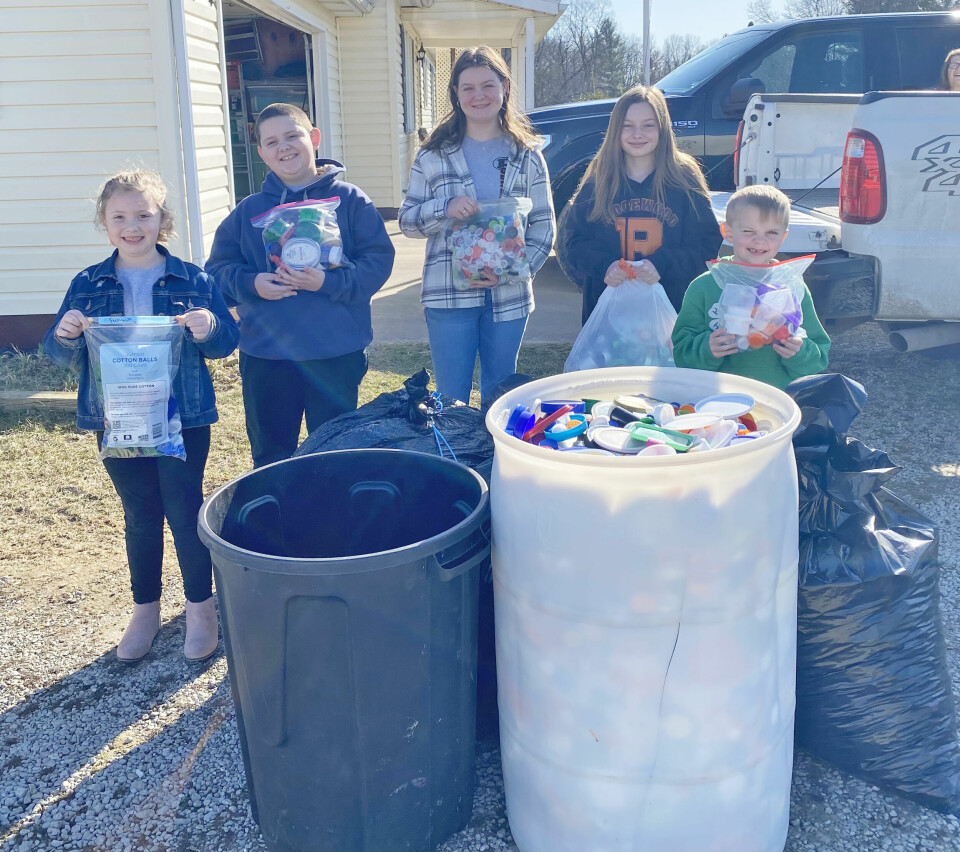 4-H clubs collect bottle caps for bench project