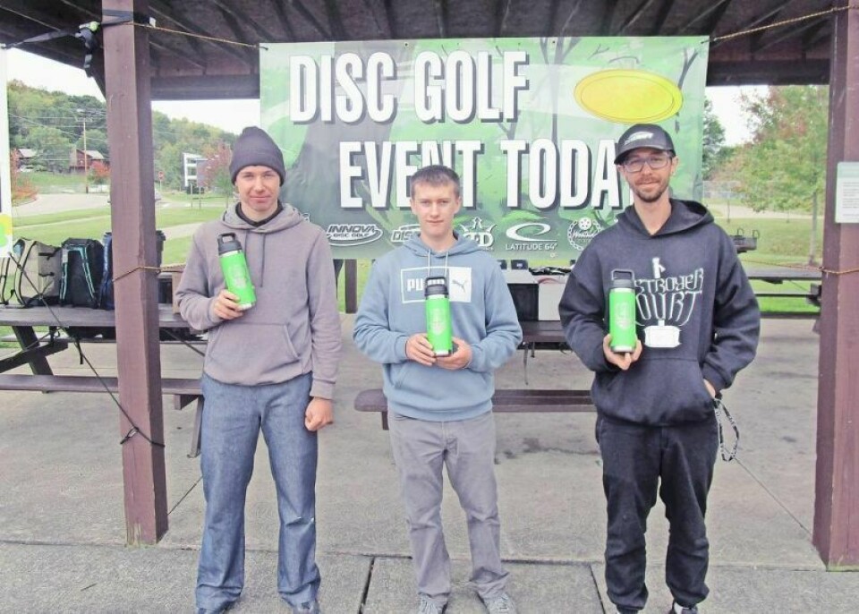 Alan Hilty, left, won the recent Holmes County Disc Golf fall tournament at Deer Run Park. Glendon Yoder, middle, was second, and Corey Carpenter, right, was third. Holmes County Disc Golf ends season