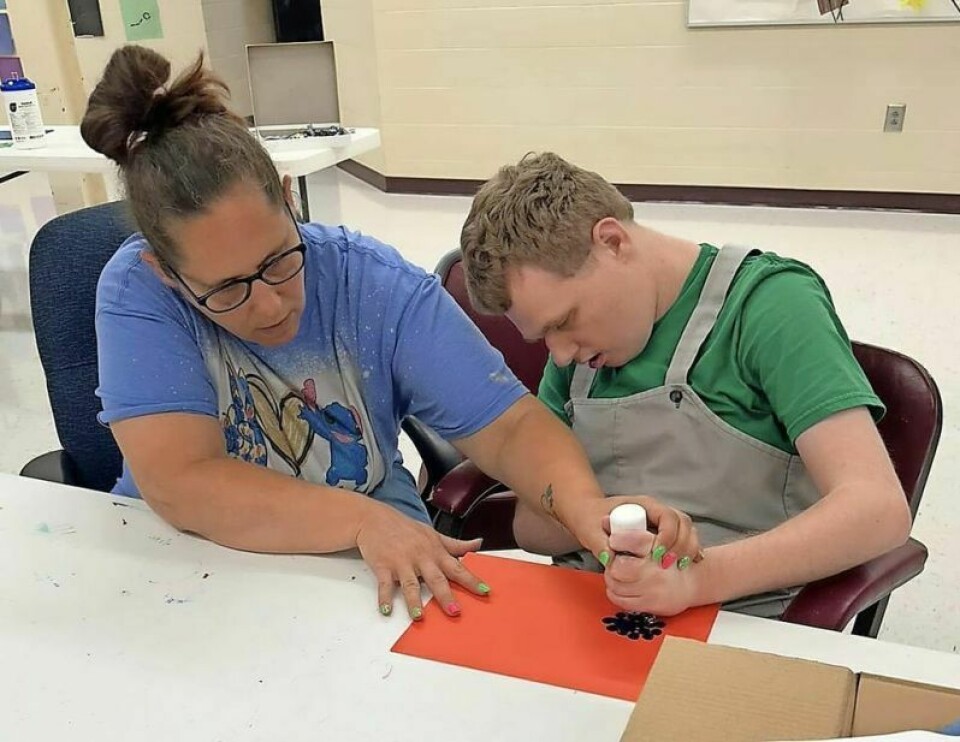 Holmes County Board of Developmental Disabilities individual Justin works at an art project. The HCBDD serves in numerous capacities in aiding and bettering the lives of individuals with special needs and their families. HCBDD levy critical to providing for special needs individuals