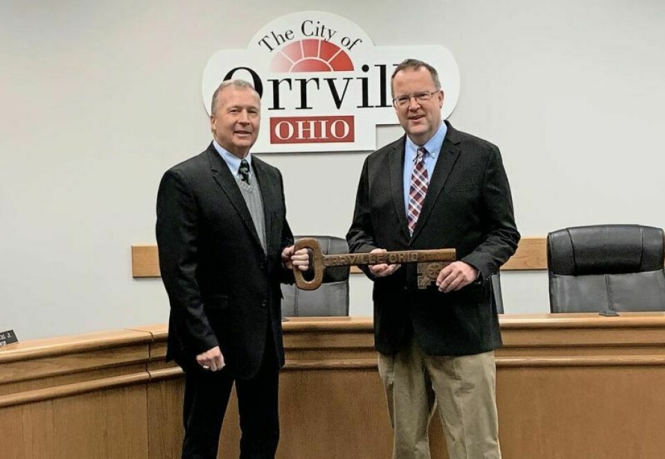 Following four terms as mayor of Orrville, Dave Handwerk, left, is turning over the key to the city to Mayor-elect Matt Plybon, who will be officially sworn in on Dec. 29 but plans to get immersed in city business way before that. Plybon set to succeed Handwerk as Orrville mayor