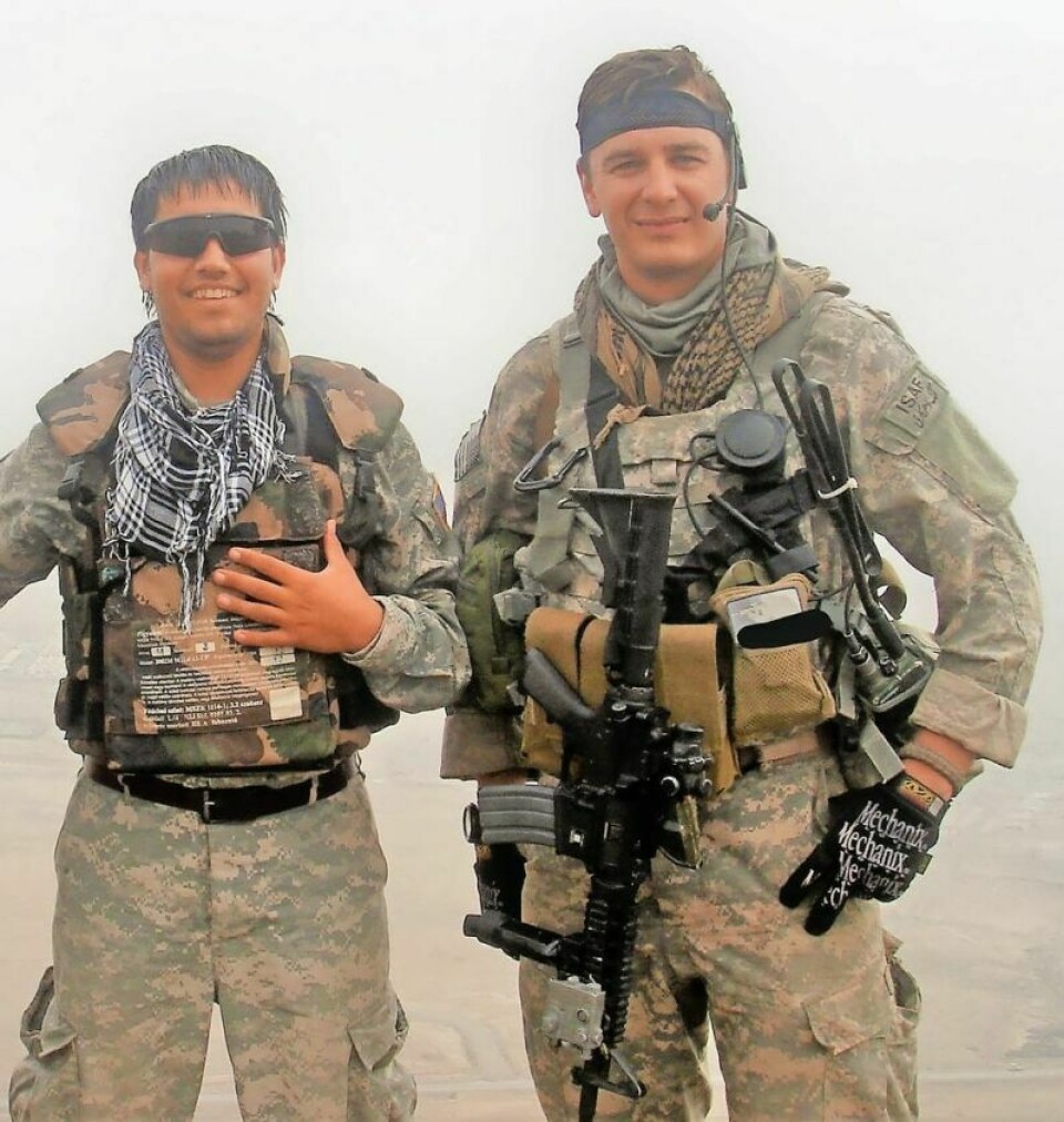 Mohammad Essa Adeeb, left, Matt Carpenter in Afghanistan Strasburg man helps refugee family get settled
