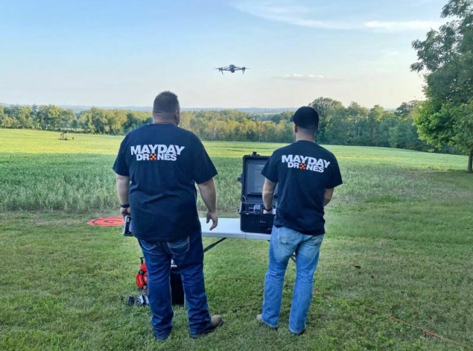 Nate Yoder, left, watches Brent Carr operate one of the drones the two employ as owners of Mayday Drones, the new business the two firefighters started that provides drone imaging and/or video footage used in a multitude of different industries. Local first responders get new drone business off the ground