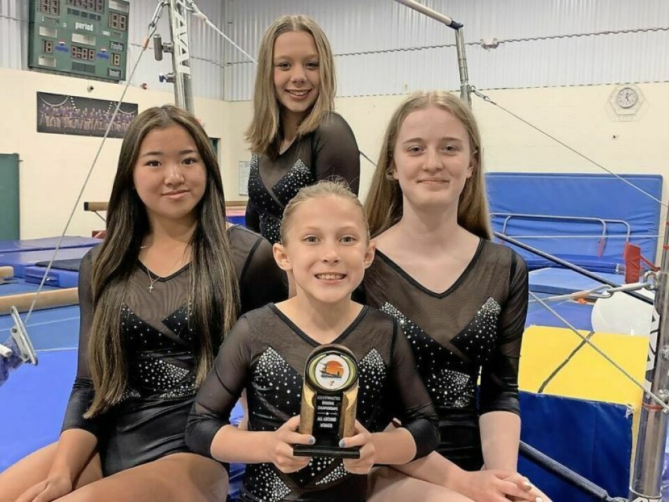 Regional champions: Ellie Horger, front, Lily Denney, left, Jaycie Baker and Lily Endlich. Gymnastics team comes home with 4 regional champions