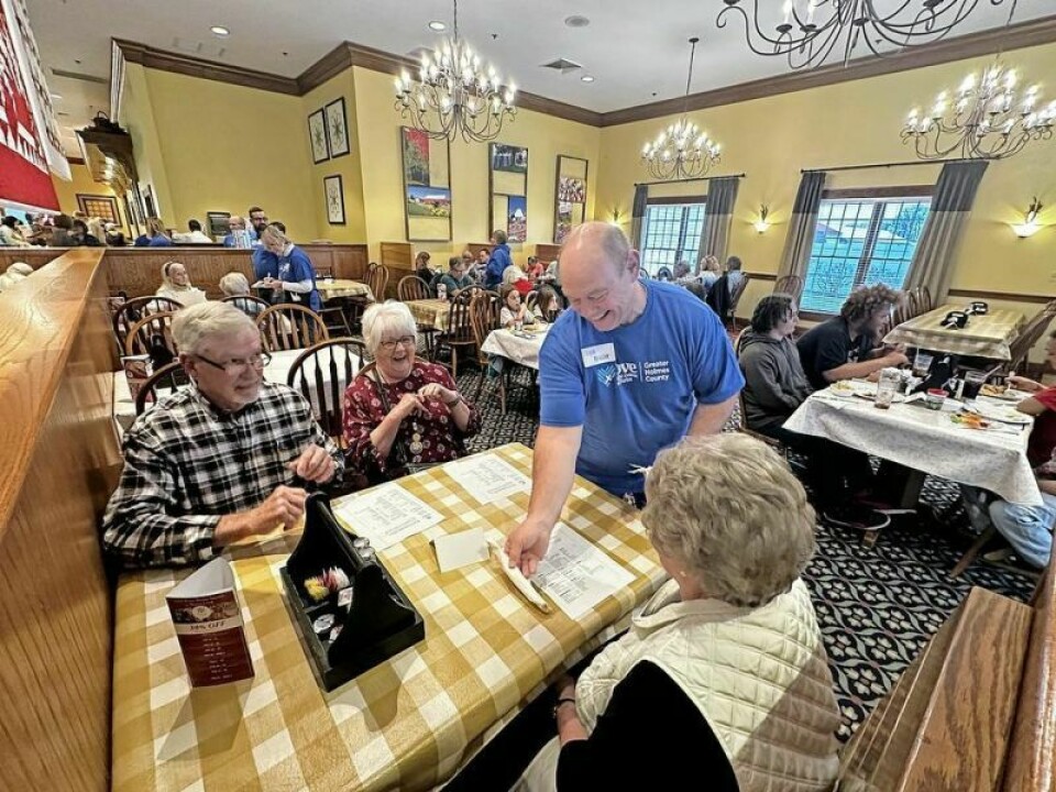 Love In the Name of Christ volunteer Lyle Reusser greets patrons during Love INC’s recent dinner fundraiser at Farmstead Restaurant in Berlin. The evening was about food, fellowship and the volunteer crew sharing Love INC’s mission with visitors. Love INC dining fundraiser about more than just food