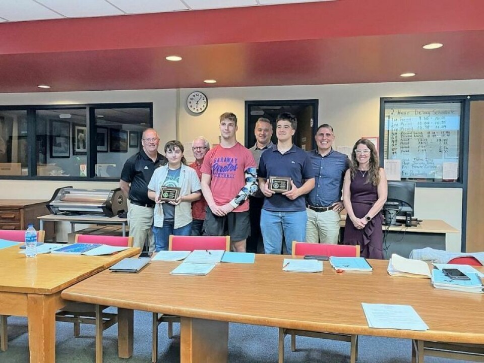Parker Weiland, left, Clayton Downs, William Miller, March Student of the Month recipients; back row, board members Bob Hannon, John Shrock, James Miller, Mike Warkall and April Beachy, board president. Garaway BOE discusses air conditioning in schools