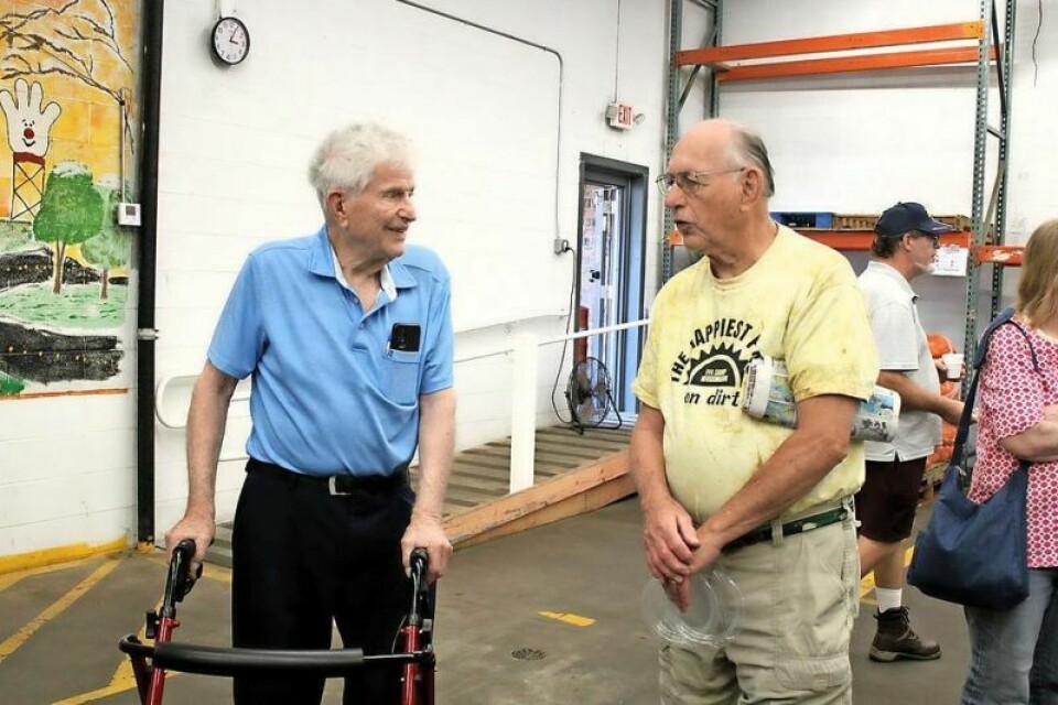 Jack Ream and Glen Groh of Dover talk at the open house. Groh has been a volunteer at the food pantry since its inception. Food pantry recognizes Burning River Church