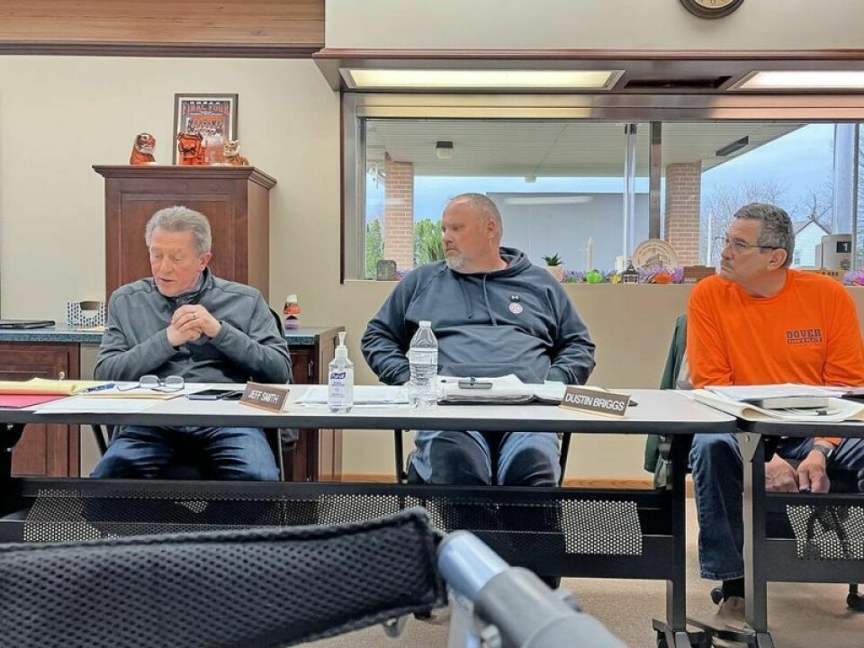 Jeff Smith, left, Dustin Briggs and Wes Hostetler, village council members Village council debates length of lease of bus garage