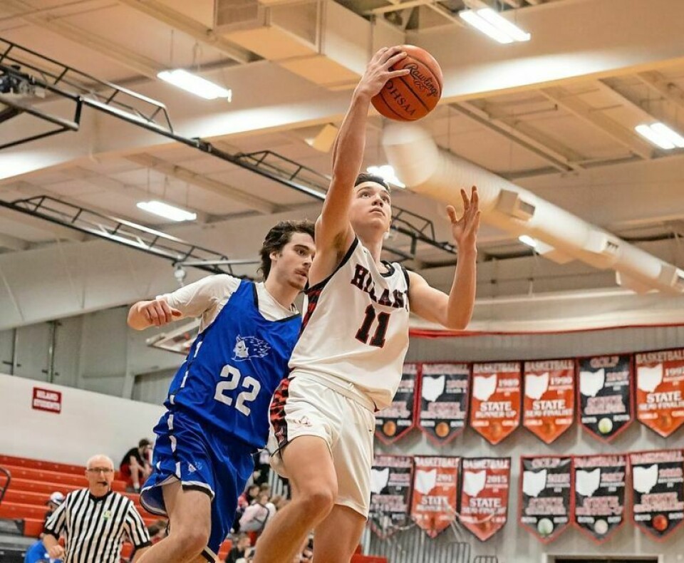 Hiland’s Sammy Detweiler, right, was an All-Ohio third-team selection in Division IV. Detweiler was one of five local players who earned All-Ohio honors. 5 locals earn All-Ohio boys basketball honors