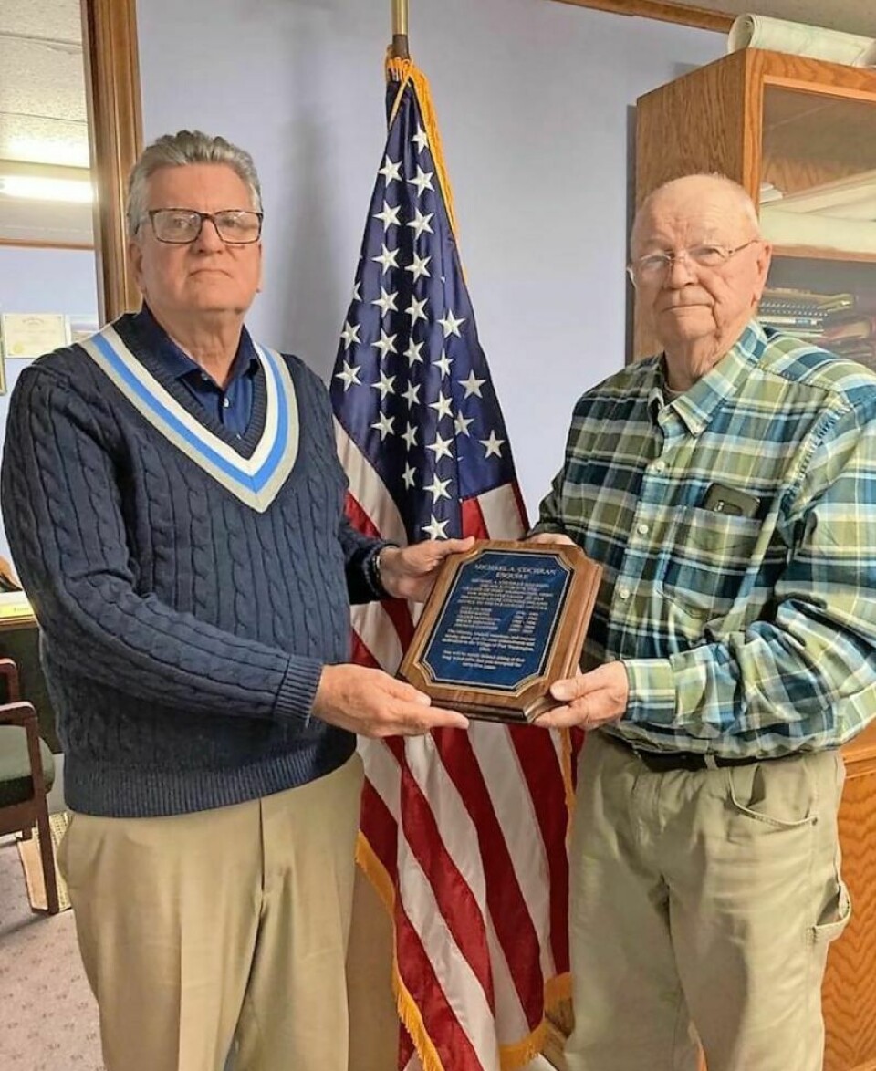 Attorney Michael Cochran, left, will retire his position as Port Washington village solicitor on Dec. 31. He was recognized by Mayor Tom Gardner with a commemorative plaque. Cochran to retire after 45 years serving village