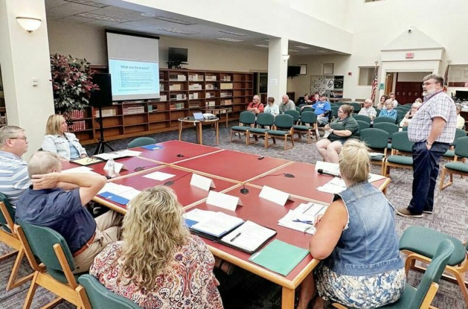 West Holmes Schools Superintendent Eric Jurkovic, right, explains the process the board and district personnel went through to arrive at the solution of building a new district school building on the current high school and middle school campus for elementary students. WH Schools unfurls plan for new k-5 building on campus