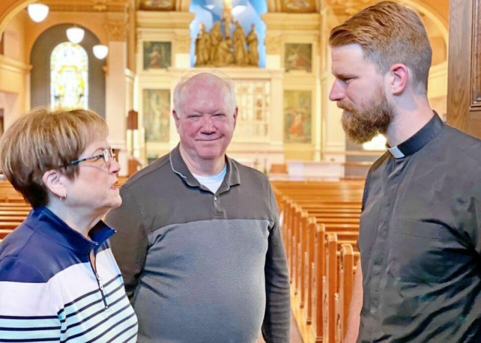 Linda Musyt, left, and Rick Davis talk with Fr. David Chojnacki, right, of St. Mary of the Immaculate Conception Church in Wooster about the upcoming Catholics Returning Home program at the church. Catholics Returning Home is starting at St. Mary